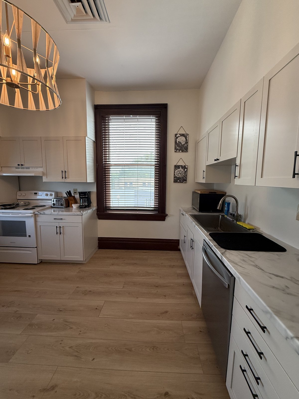 Kitchen — stove, sink, and garden window